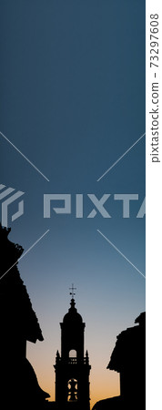 Belfry silhouette with plain sky in the background Belfry silhouette with plain sky in the background 73297608