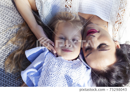 young pretty pregnant brunette woman having fun with her daughter on picnic on green grass in park, lifestyle people concept young pretty pregnant brunette woman having fun with her daughter on picnic on green grass in park, lifestyle people concept 73298043