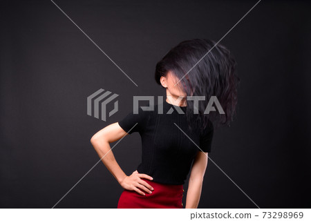 Young beautiful Asian transgender businesswoman against black background 73298969