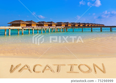 Word Vacation on beach 73298999