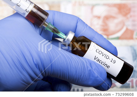 Vaccine against Covid-19 on the background of Peruvian money Vaccine against Covid-19 on the background of Peruvian money 73299608