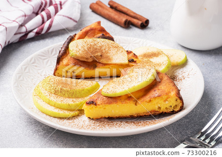Cottage cheese casserole with apples and cinnamon spices. Concept of a healthy Breakfast. 73300216