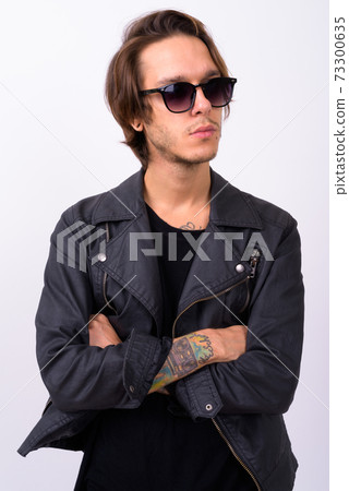 Young handsome rebellious man against white background 73300635