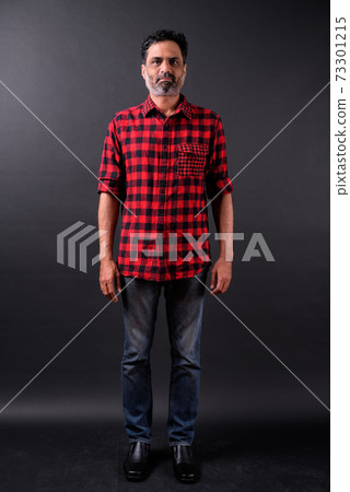 Portrait of mature bearded Indian hipster man Portrait of mature bearded Indian hipster man 73301215