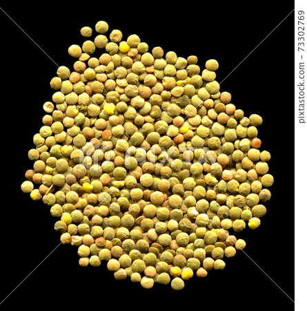 Green lentil grains isolated on black background Green lentil grains isolated on black background 73302769