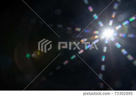Abstract sun flare. The lens flare is subject to digital correction Abstract sun flare. The lens flare is subject to digital correction 73302895