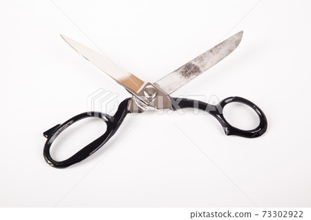 vintage household scissors isolated over white background