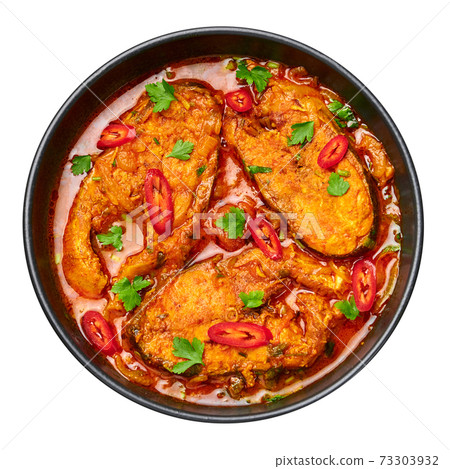 Macher Jhol in black bowl isolated on white. Indian cuisine Bengali Fish Curry. Asian food 73303932