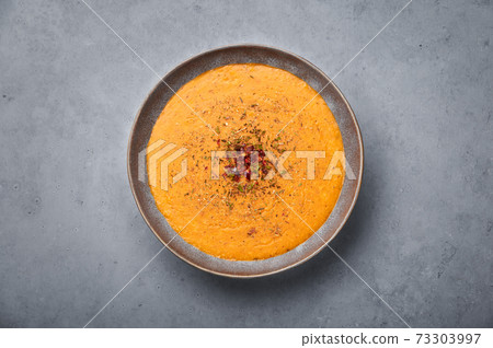 Ezogelin Soup in gray bowl on concrete table top. Turkish cuisine traditional dish 73303997