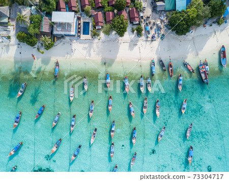 Aerial view of long tail boats in Andaman sea at Lipe Island 73304717