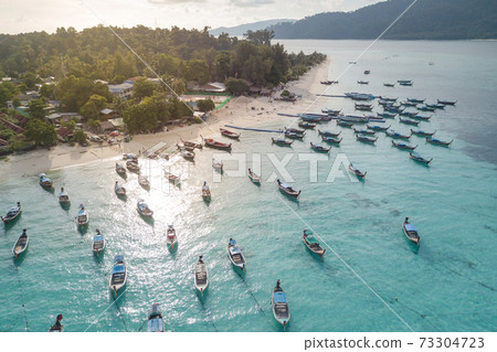 Aerial view of long tail boats in Andaman sea at Lipe Island 73304723