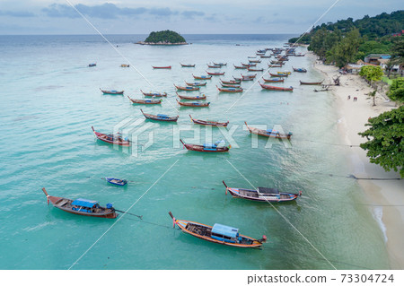 Aerial view of long tail boats in Andaman sea at Lipe Island 73304724