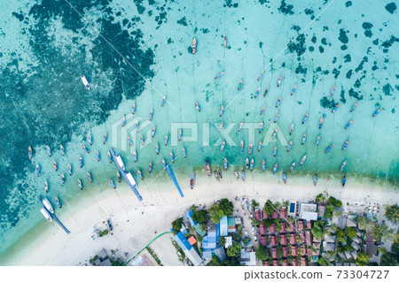 Aerial view of long tail boats in Andaman sea at Lipe Island 73304727