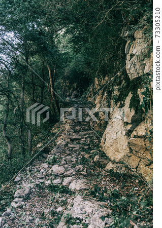 mountains of sadernes on a cloudy summer day in spain mountains of sadernes on a cloudy summer day in spain 73305210