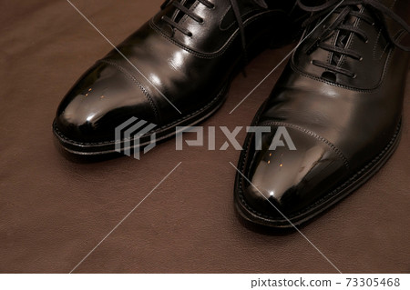 Shiny polished black leather shoes 73305468
