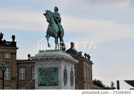 A statue standing in front of Frederik's Church, a landmark in Copenhagen, the capital of Denmark 73306403