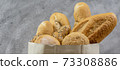 Bread variety in disposalable paper bag. Panoramic 73308886