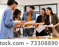 Interracial business team meeting smile and brainstorm 73308890