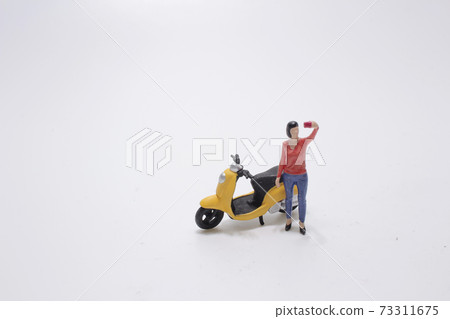 a mini girl take a self portrait with moto bike 73311675
