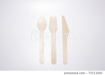 a set of Wooden spoon, knife and fork a set of Wooden spoon, knife and fork 73311695