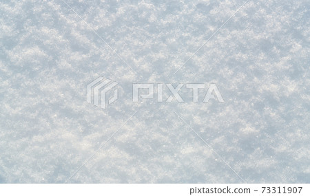 Snow surface under bright winter sun light Snow surface under bright winter sun light 73311907