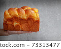 Brioche is a bread of French origin that is similar to a highly enriched pastry, and whose high egg and butter content gives it a rich and tender crumb 73313477