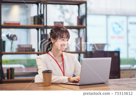 Woman working in Sure office 73313612