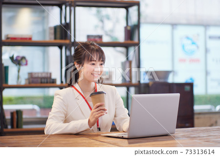 Woman working in Sure office 73313614