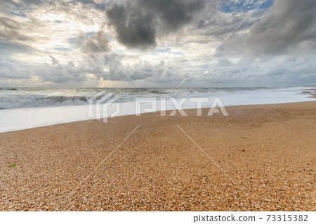 Sandy beach on the Atlantic coast in France. Sandy beach on the Atlantic coast in France. 73315382