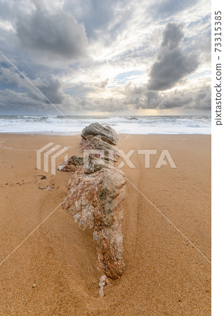 Rocks on a sandy beach in the Atlantic Ocean Rocks on a sandy beach in the Atlantic Ocean 73315385