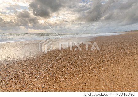 Sandy beach on the Atlantic coast in France. 73315386