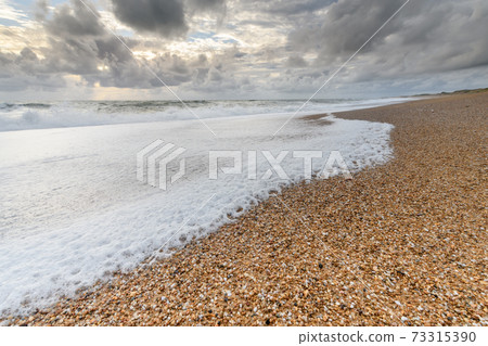 Sandy beach on the Atlantic coast in France. Sandy beach on the Atlantic coast in France. 73315390