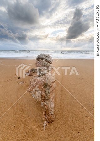 Rocks on a sandy beach in the Atlantic Ocean Rocks on a sandy beach in the Atlantic Ocean 73315395