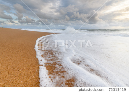 Sandy beach on the Atlantic coast in France. Sandy beach on the Atlantic coast in France. 73315419