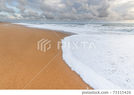 Sandy beach on the Atlantic coast in France. Sandy beach on the Atlantic coast in France. 73315420