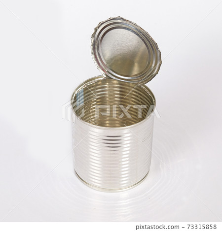 Emptry tin can opened on background. 73315858