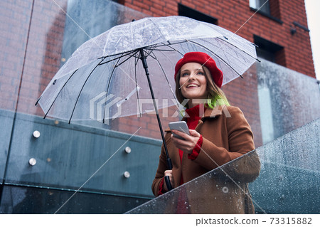 Woman standing at the stairs and looking away 73315882