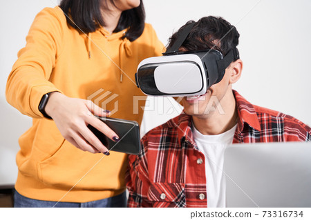 Designer using virtual reality glasses 73316734