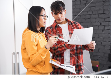 Designers talking to each other about work tasks 73316797