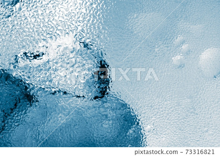 Ice cubes as background texture closeup photo 73316821