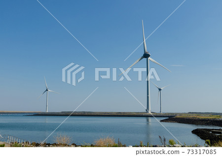 Oosterscheldekering, the netherlands, August 2019. In the Zeeland countryside, wind farms Oosterscheldekering, the netherlands, August 2019. In the Zeeland countryside, wind farms 73317085