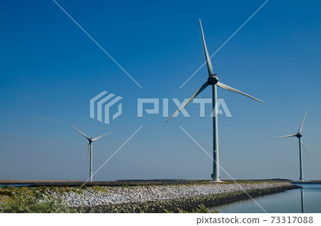 Oosterscheldekering, the netherlands, August 2019. In the Zeeland countryside, wind farms 73317088