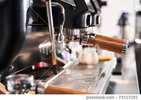 Coffee machine making a cup of coffee 73317291