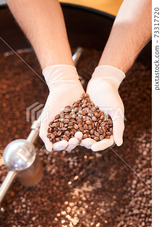 Roasted coffee grains in the shape of a heart Roasted coffee grains in the shape of a heart 73317720