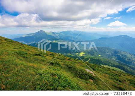 hoverla peak of carpathian black ridge. beautiful summer landscape at noon. clouds on the sky above the valley. view from petros mountain slope covered in grass 73318478