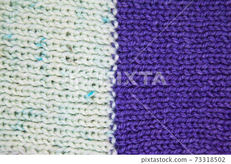 Handmade knitted fabric purple and white wool background texture 73318502