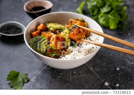 Fried vegan tofu bowl with broccoli and rice Fried vegan tofu bowl with broccoli and rice 73319013