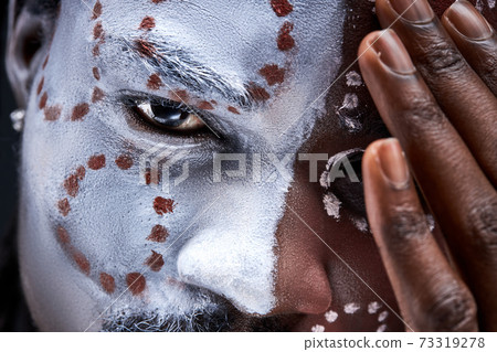 confident african male with national ethnic make-up on face confident african male with national ethnic make-up on face 73319278