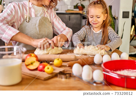 helpful child girl knead with mom helpful child girl knead with mom 73320012