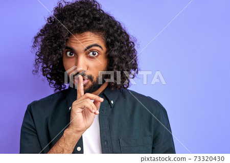 tss... let's not tell anyone, curly arabic guy keep silence tss... let's not tell anyone, curly arabic guy keep silence 73320430